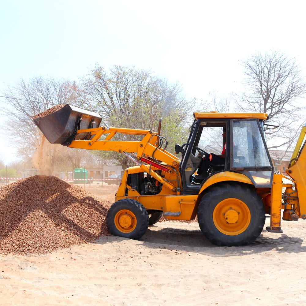 A loader moving material on a work site